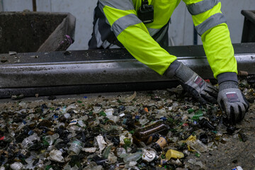 an operator removes remains that cannot be recycled
