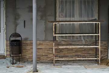 View of the building with a window and an urn. Renovation of an old residential building. The...