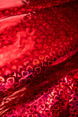 Bright red hearts gift wrap as background 