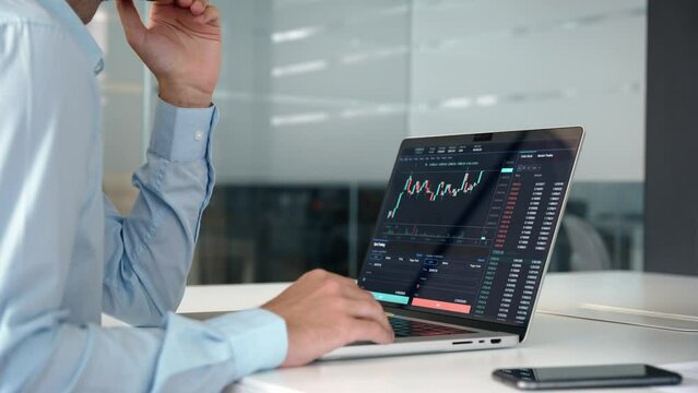 Investor trader analyzing financial trading crypto stock market checking balance digital data doing investing analysis looking at computer screen thinking of inflation drop risk. Close up view.
