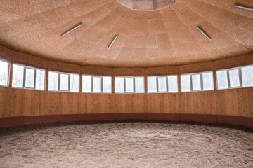 round pen for training horses. How it looks inside. Wooden stable