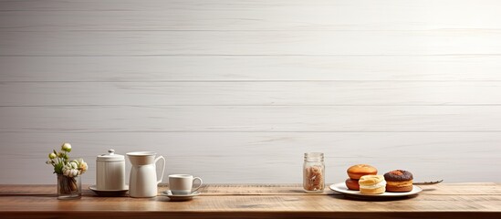 Fototapeta na wymiar In a vintage-inspired cafe, a wooden table with a textured white surface is artfully arranged with food and beverages, including a cup of aromatic coffee and a glass of black tea. The isolated white