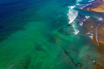 Aerial view of a pristine beach with crystal clear water, Baja beach