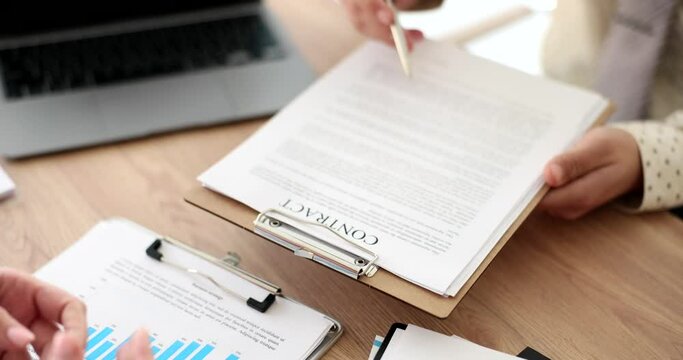 Seo gives contract for signature of clients or employee. Making a profitable financial deal or hiring