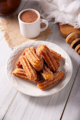 Churros. Fried wheat flour dough, a very popular sweet snack in Spain, Mexico and other countries where it is customary to eat them for breakfast or snack accompanied by hot chocolate or coffee.