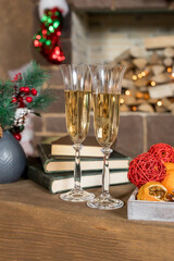 glasses for champagne, Christmas time decorations, New Year dinner, luxury home interior.Champagne and new year decor. cozy home, ready for winter holidays