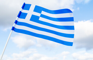 Flag of Greece against the blue sky. European state.
