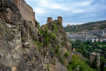 Fototapeta na wymiar Narikala (Georgian: ნარიყალა) is a former fortress overlooking the Georgian capital Tbilisi and the Mtkvari (Kura) River. Upper Betlemi Church and the magnificent view of Tbilisi city.