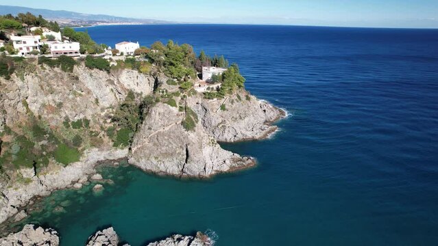 Aerial video from drone, coastline of Costa degli Aranci. Breathtaking scenery of the most beautiful beaches on the coast. Impressive coastline, picturesque bay, rocky gray cliffs, Ionian Sea, souther