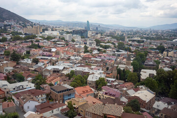 Fototapeta premium The Kura river, The Bridge of Peace, the cathedral, churches and the magnificent view of Tbilisi city from the cable car.
