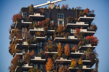 MILAN, ITALY- NOVEMBER 21, 2023 - "Bosco Verticale", vertical forest in autumn time, design apartments and buildings in the district "Isola" of the city of Milan, Italy