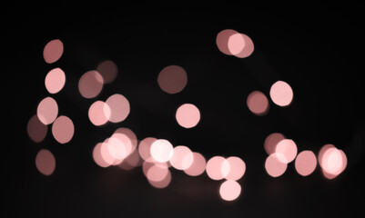 Pink defocused bokeh lights overlay. Pink coloured  lens flare bokeh for design.