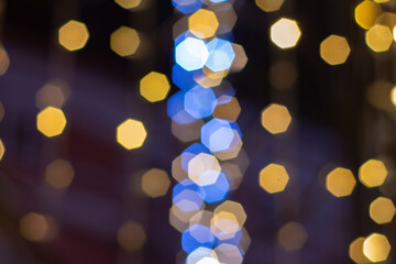 Golden bokeh background with glitter lights for Christmas and New year. Blurred Bokeh Glitter Christmas  Xmas Holiday.