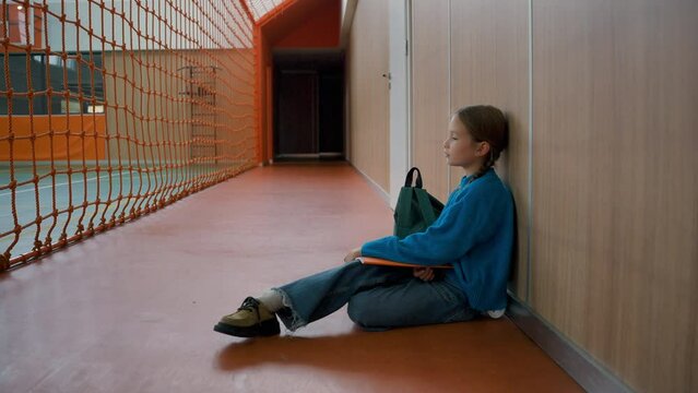 Unhappy Little Girl Sitting Floor Gym Tired Primary School Lesson Schoolgirl Fatigue Weary Child Alone Frustrated Inside Stress Kid Learner Sport Physical Activity Pupil Education Exam Break Exercise