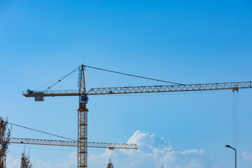 Tower cranes. Construction industry background photo