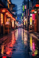 Japanes neon street at night. Wet and long empty street.