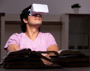 Male student with virtual glasses late at home