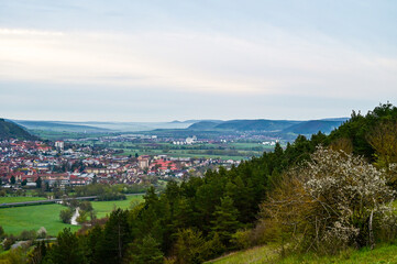 Fototapeta na wymiar Panorama über Hammelburg im Saaletal bie Sonnenaufgang, mit Blick vom Truppenübungsplatz, Bad Kissingen, Franken, Bayern, Deutschland im Sommer