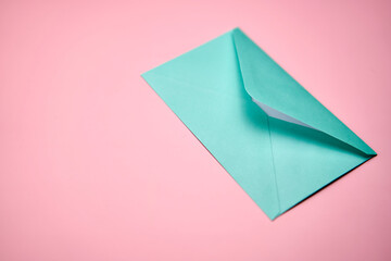 Blue love letter on a pink background.