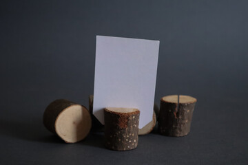 White empty cards with copy space in natural wooden stump.