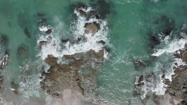 Aerial: Sandy beach in the Bay of Islands, Elliot Bay, New Zealand
