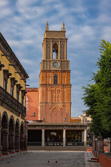 Clock tower in a traditional, classic, colorful and rustic town