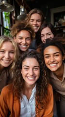 Obraz premium Vertical portrait of smiling students women looking at camera with friends in background.