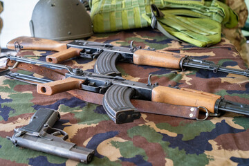 Two old Kalashnikov assault rifles with  military equipments