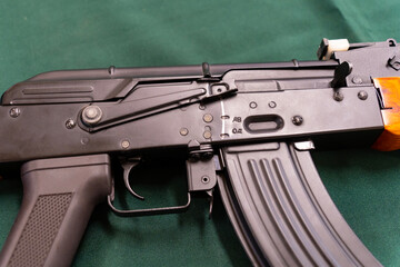 AK-47 Kalashnikov airsoft assault rifle with a green background