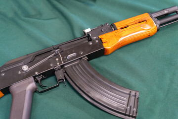 AK-47 Kalashnikov airsoft assault rifle with a green background