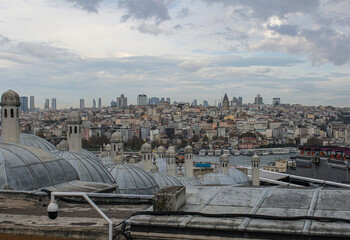 Istanbul's Beyoğlu district with historic domes in the foreground and modern skyscrapers in the...