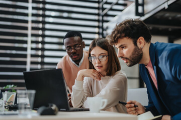 A diverse team collaborates in a modern office, brainstorming and strategizing for business expansion and sustainable growth.