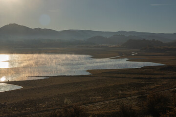 autumn, autumn views, autumn forests. views of a plain with a lake, mist is coming out of the lake, it is an autumn paradise. 
