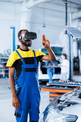 Professional in auto repair shop using virtual reality technology to visualize car alternator in order to fix it. Effective garage employee wearing futuristic vr headset while mending faulty vehicle