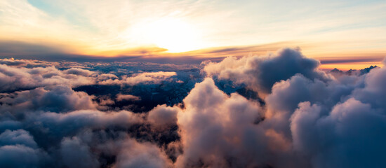 Cloudscape over Canadian Mountain Landscape. Aerial. Dramatic Clouds Sunset Sky