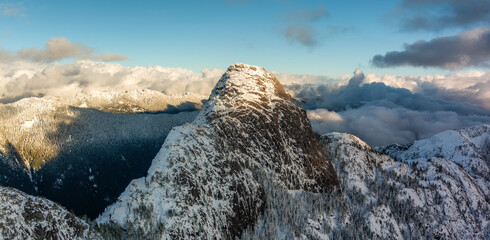 Dramatic Canadian Mountain Landscape. Aerial Panorama. Cloudy Sunset.
