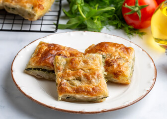 Greek cuisine; Spinach Tart or Spinach Pie. Turkish name; ispanakli borek or ispanakli tart