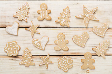 Cute homemade Christmas cookies on wooden background,top view