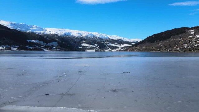 Ice on Voss lake in Norway, flying low with a drone
