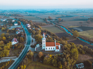 Aerial autumn view at church  in Chelmno on the Ner River, a village in Poland
