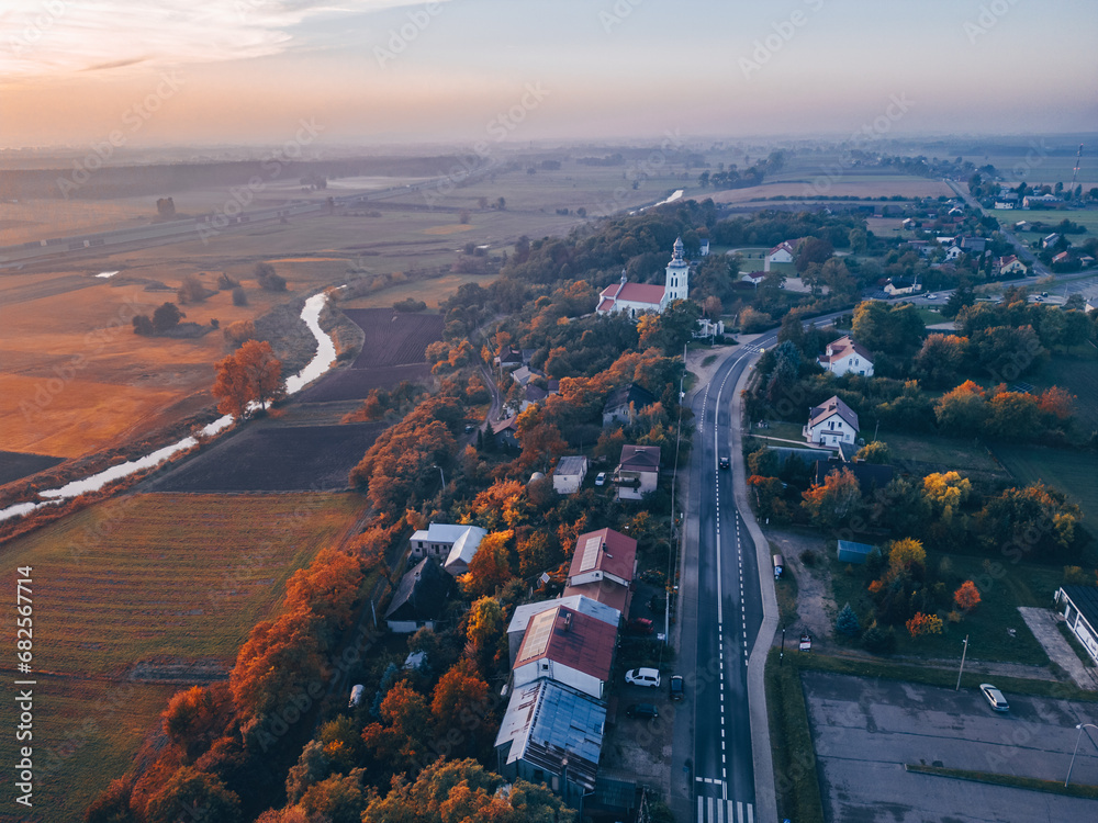 Wall mural Aerial autumn view at church  in Chelmno on the Ner River, a village in Poland