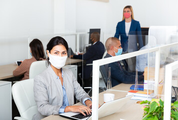 asian female manager in white office during pandemic