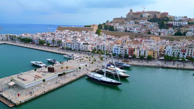 Sailing yacht aerial view flight drone Ibiza Town old City Harbor Port promenade