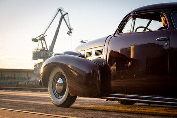 1940 Cadillac custom with top chop and lowering at a danube harbor in bavaria, germany. - obrazy, fototapety, plakaty