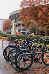 Fototapeta premium Foggy day, bikes parked near Pamplona's bullring in autumn ambiance.