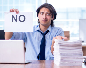 Young employee unhappy with excessive work
