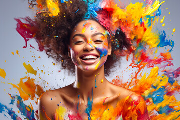 Laughing woman with splashes of colorful paint on her body and face. - obrazy, fototapety, plakaty