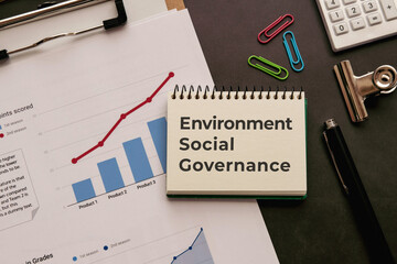 There is notebook with the word Environment Social Governance. It is as an eye-catching image.