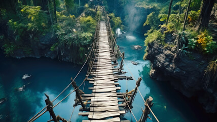 Old suspension bridge across river in jungle, perspective view of hanging vintage wooden footbridge. Scenery of tropical forest and water. Concept of travel, adventure, nature - obrazy, fototapety, plakaty
