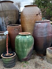 Obraz premium beautiful glazed pottery vessels for interior or exterior design spaces, potted plants, tropical plants, planters, patio pots